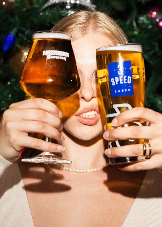 Draught beer and canned lager photographed with people enjoying them
