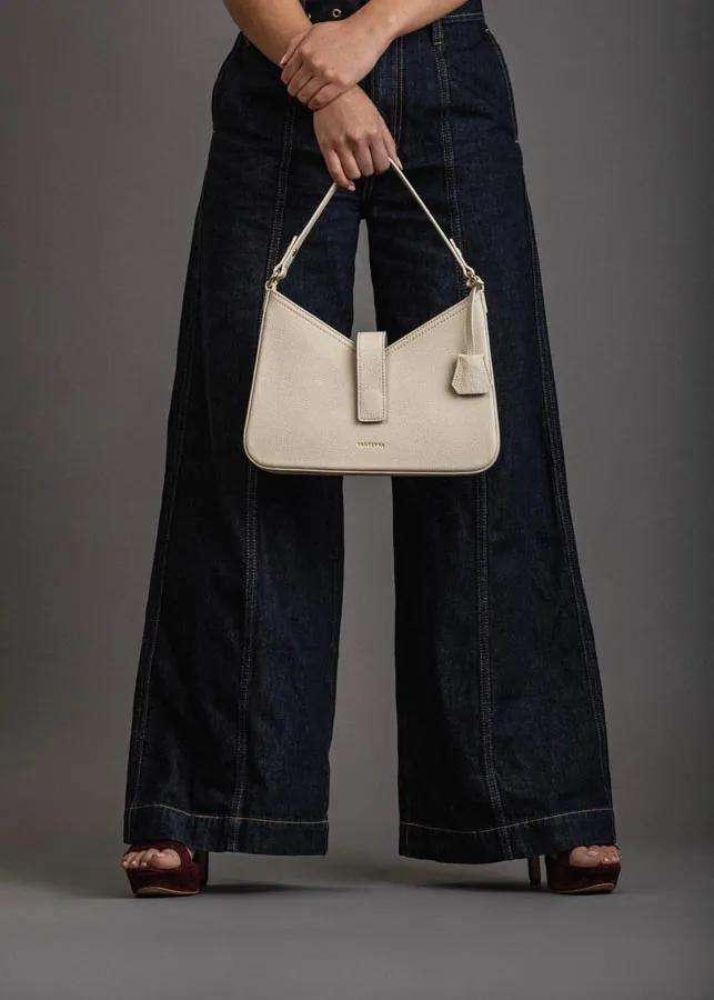 Apparel photographed on a model in a styled set