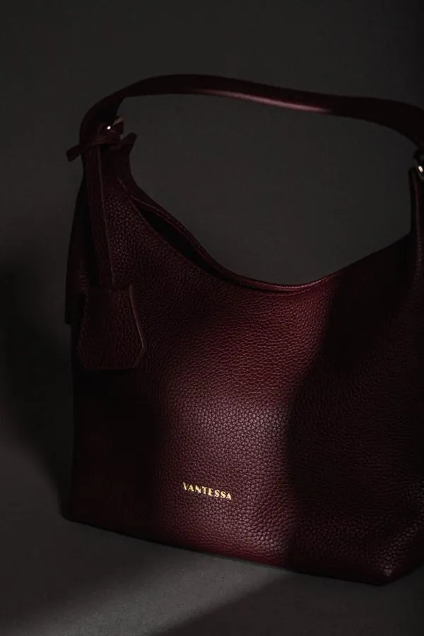 Leather handbags photographed on a minimal studio set
