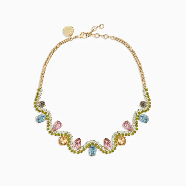 Multicoloured gemstone statement necklace on a white background